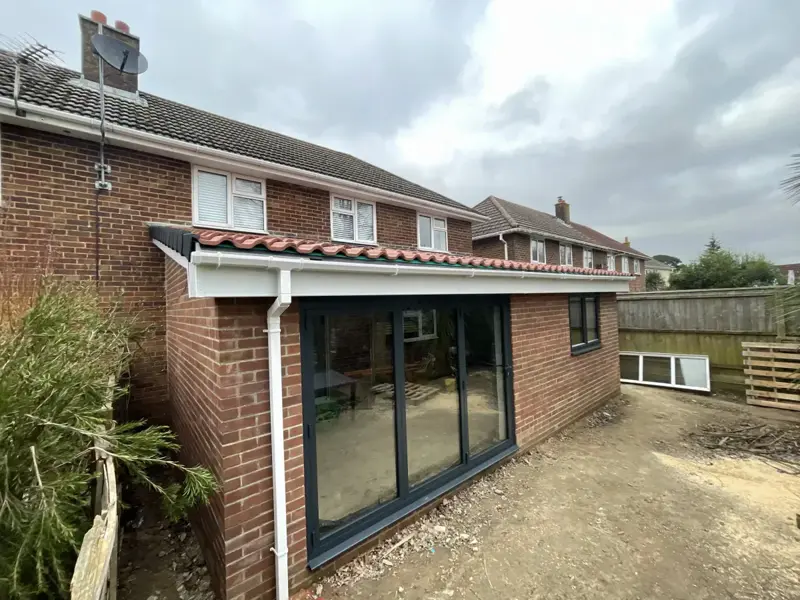 Single-storey rear extension with anthracite bi-fold doors in Bournemouth